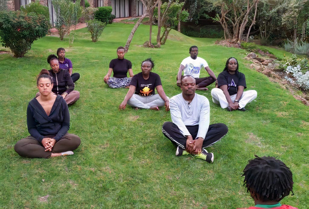 Beneficiaries during a meditation session.